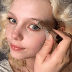 Applying eyebrow gel for natural-looking definition